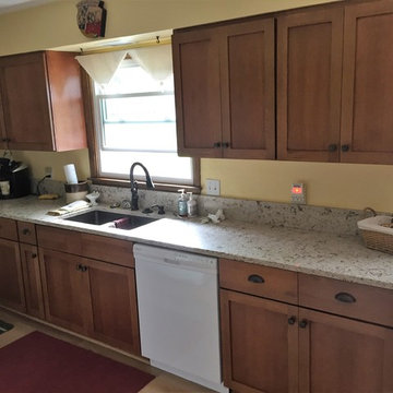 Omega Cabinetry, Puritan door, Quartersawn Oak wood, Nutmeg stain