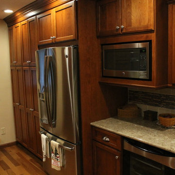 Omega Cabinetry, Ultima door, Cherry wood, Nutmeg stain.