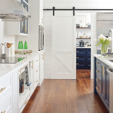 Omega Cabinetry: White Kitchen with Sliding Barn Door