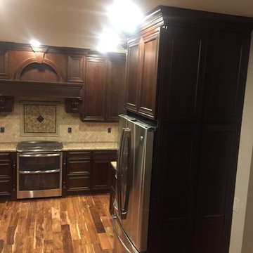 Omega Cabinets, Conklin door, Cherry wood, Chestnut stain.