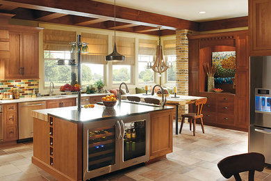 Example of a large arts and crafts u-shaped travertine floor and beige floor eat-in kitchen design in Chicago with stainless steel appliances, multicolored backsplash, medium tone wood cabinets, an island, an undermount sink, shaker cabinets, granite countertops and subway tile backsplash