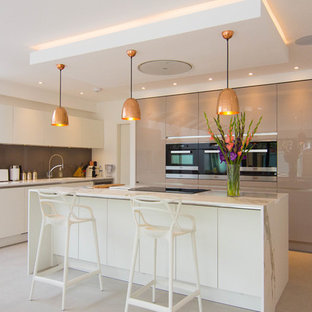 Inspiration for a medium sized contemporary l-shaped kitchen in London with a submerged sink, flat-panel cabinets, white cabinets and an island.