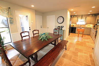 Medium sized traditional kitchen/dining room in Dallas with travertine flooring.