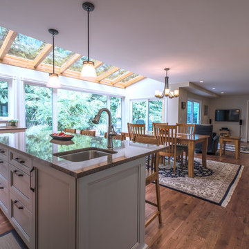 Open Concept Kitchen & Dining Area With Skylights