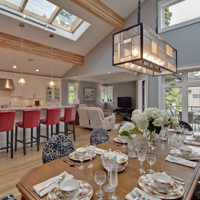 Inspiration for a contemporary l-shaped open concept kitchen remodel in Vancouver with stainless steel appliances, white backsplash, recessed-panel cabinets, white cabinets, granite countertops and subway tile backsplash