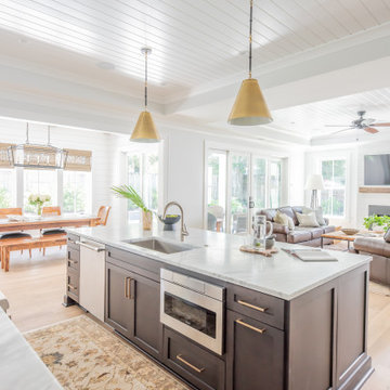 Open Kitchen with Shiplap Ceiling, Pendant lights and Oversized Island