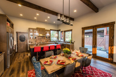 Example of a large transitional l-shaped dark wood floor eat-in kitchen design in Other with an island, flat-panel cabinets, dark wood cabinets, wood countertops, brown backsplash, a farmhouse sink, ceramic backsplash and stainless steel appliances