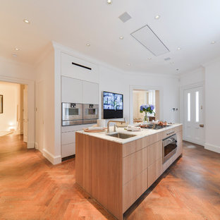 Photo of a medium sized contemporary l-shaped kitchen in London with a submerged sink, flat-panel cabinets, medium wood cabinets, white splashback, stainless steel appliances, medium hardwood flooring, an island, brown floors, white worktops, marble worktops and marble splashback.