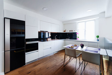 Kitchen - modern kitchen idea in Other