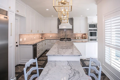 Inspiration for a large contemporary l-shaped kitchen remodel in Dallas with white cabinets, quartzite countertops, white backsplash, stone slab backsplash, two islands and white countertops