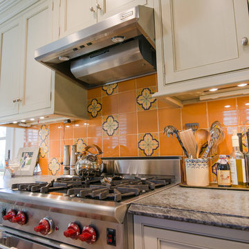 Orange Backsplash with Stainless Steel Vent A Hood