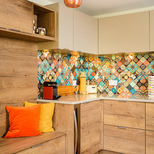 This is an example of a small retro l-shaped kitchen in Other with flat-panel cabinets, quartz worktops, multi-coloured splashback, beige cabinets and beige worktops.