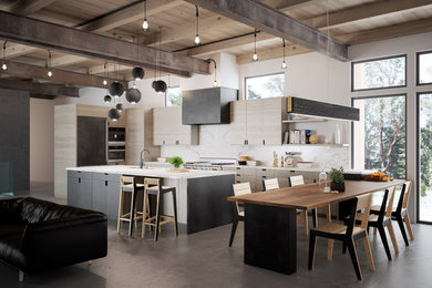 Large contemporary u-shaped open plan kitchen in Seattle with stone slab splashback, concrete flooring, flat-panel cabinets, light wood cabinets, marble worktops, white splashback and an island.