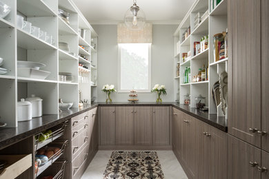 Mid-sized transitional u-shaped marble floor and gray floor kitchen pantry photo in Charleston with shaker cabinets, brown cabinets and laminate countertops
