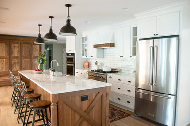 Inspiration for a farmhouse open concept kitchen remodel in Houston with shaker cabinets and an island