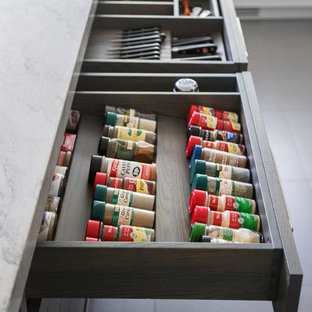 Mid-sized transitional eat-in kitchen inspiration - Inspiration for a mid-sized transitional l-shaped porcelain tile and gray floor eat-in kitchen remodel in New York with a single-bowl sink, flat-panel cabinets, white cabinets, quartzite countertops, brown backsplash, brick backsplash, stainless steel appliances and an island