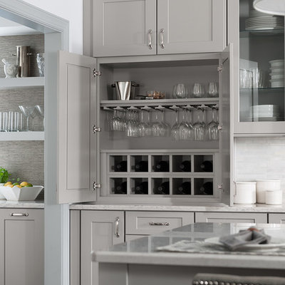 Inspiration for a transitional kitchen remodel in DC Metro with shaker cabinets, gray cabinets, quartz countertops, white backsplash and an island