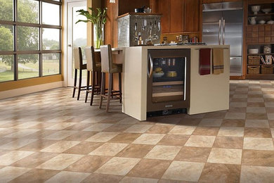 Inspiration for a large timeless single-wall porcelain tile eat-in kitchen remodel in Other with flat-panel cabinets, medium tone wood cabinets, brown backsplash, porcelain backsplash, stainless steel appliances and an island