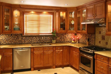 Ceramic tile kitchen photo in San Diego with medium tone wood cabinets, granite countertops and stainless steel appliances