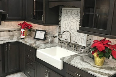 Inspiration for a timeless marble floor and gray floor kitchen remodel in Other with an undermount sink, recessed-panel cabinets, gray cabinets, granite countertops, gray backsplash and marble backsplash