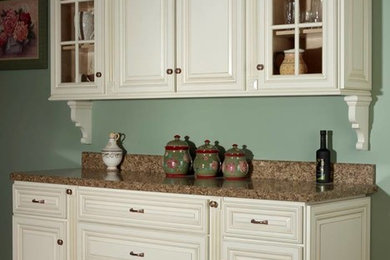 Kitchen - transitional l-shaped kitchen idea in Other with raised-panel cabinets and granite countertops