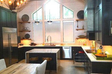 This is an example of a medium sized traditional u-shaped kitchen/diner in Other with a submerged sink, shaker cabinets, grey cabinets, composite countertops, stainless steel appliances, concrete flooring, an island, grey floors and white worktops.