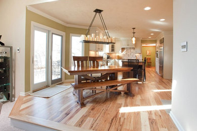Large elegant medium tone wood floor kitchen/dining room combo photo in Indianapolis