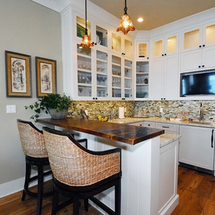 Design ideas for a small transitional l-shaped open plan kitchen in Other with shaker cabinets, white cabinets, copper benchtops, multi-coloured splashback, glass tile splashback, medium hardwood floors, an undermount sink, stainless steel appliances, a peninsula and brown floor.