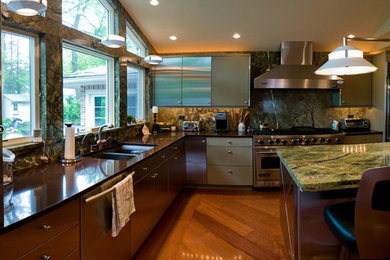 Photo of a large kitchen in New York with stainless steel appliances and an island.