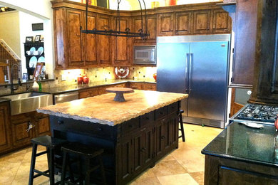 Open concept kitchen - rustic u-shaped open concept kitchen idea in Dallas with beaded inset cabinets and an island