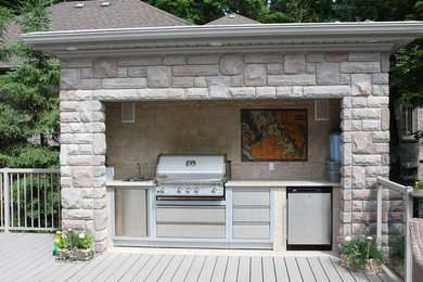 Elegant galley kitchen photo in Toronto with ceramic backsplash