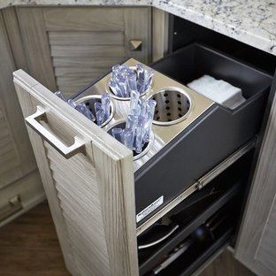 Design ideas for a traditional l-shaped eat-in kitchen in Other with a farmhouse sink, louvered cabinets, distressed cabinets, granite benchtops, grey splashback, mosaic tile splashback and stainless steel appliances.