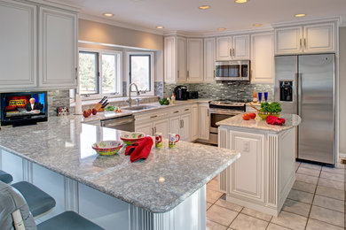 Kitchen - traditional kitchen idea in Baltimore with granite countertops, ceramic backsplash and an island