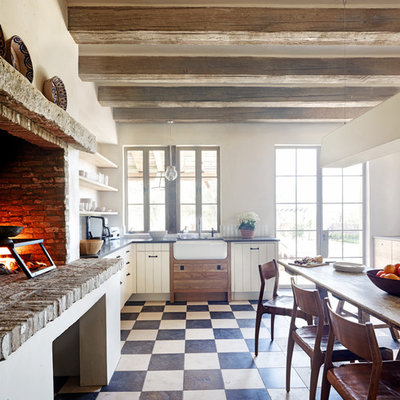 Inspiration for a rustic multicolored floor kitchen remodel in Phoenix with a farmhouse sink