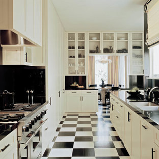 This is an example of an expansive victorian kitchen in San Francisco with white cabinets and multi-coloured floor.
