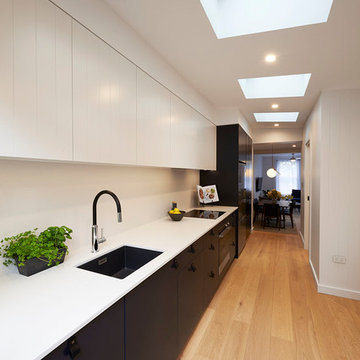 Black and white kitchen with skylight
