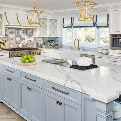 Inspiration for a large timeless u-shaped medium tone wood floor and brown floor eat-in kitchen remodel in Columbus with a farmhouse sink, recessed-panel cabinets, blue cabinets, quartz countertops, multicolored backsplash, ceramic backsplash, stainless steel appliances, an island and gray countertops