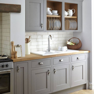 Eat-in kitchen - mid-sized transitional single-wall medium tone wood floor and brown floor eat-in kitchen idea in Columbus with a drop-in sink, recessed-panel cabinets, gray cabinets, wood countertops, white backsplash, ceramic backsplash, stainless steel appliances and brown countertops