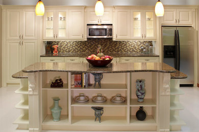 Eat-in kitchen - mid-sized traditional l-shaped laminate floor and white floor eat-in kitchen idea in Orlando with an undermount sink, raised-panel cabinets, white cabinets, laminate countertops, brown backsplash, matchstick tile backsplash, stainless steel appliances and an island