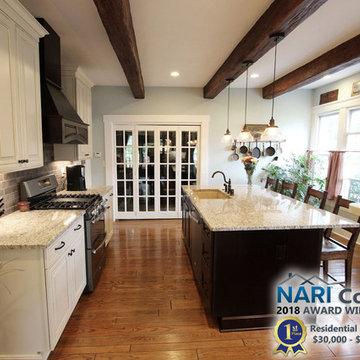 Painted Cream with Brown Glaze Cabinets with Giallo Granite Countertops ~ Sevill
