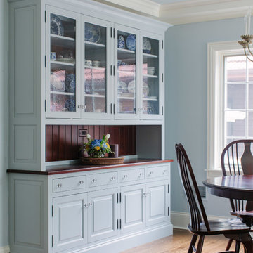 Painted gray blue dish storage in eating area