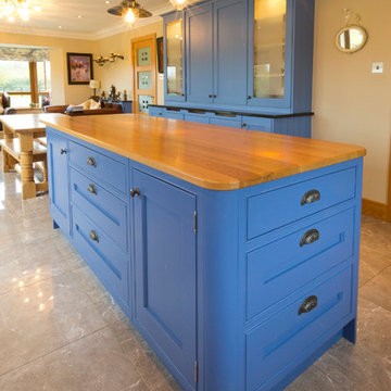 Painted kitchen in Lulworth Blue 89, Oak island worktop and Jet
