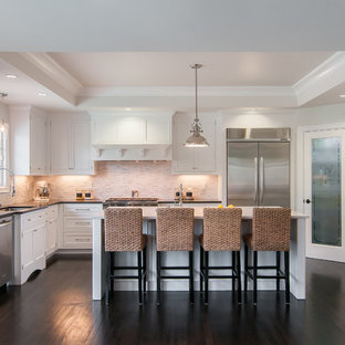 Example of a transitional kitchen design in San Francisco with an undermount sink, recessed-panel cabinets, white cabinets, beige backsplash, stainless steel appliances and matchstick tile backsplash