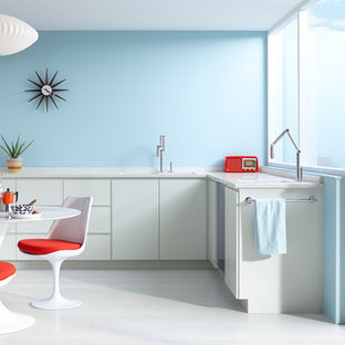 Mid-sized contemporary eat-in kitchen appliance - Example of a mid-sized trendy l-shaped concrete floor and gray floor eat-in kitchen design in Milwaukee with a double-bowl sink, flat-panel cabinets, white cabinets, quartzite countertops, stainless steel appliances and no island