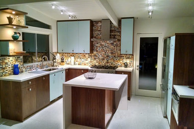 Example of a mid-century modern kitchen design in Other
