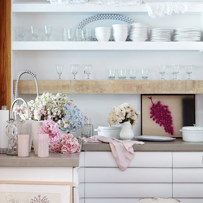 Example of a small cottage chic kitchen design in Los Angeles with open cabinets, white cabinets and white backsplash