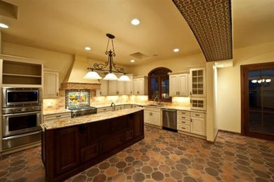 Example of a tuscan kitchen design in Albuquerque