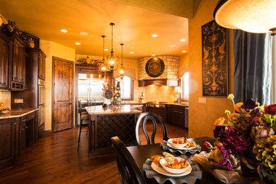 Tuscan kitchen photo in Denver with an island