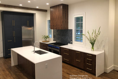 Example of a large minimalist u-shaped medium tone wood floor, brown floor and exposed beam eat-in kitchen design in Denver with a single-bowl sink, flat-panel cabinets, blue cabinets, quartz countertops, blue backsplash, glass tile backsplash, stainless steel appliances, an island and white countertops