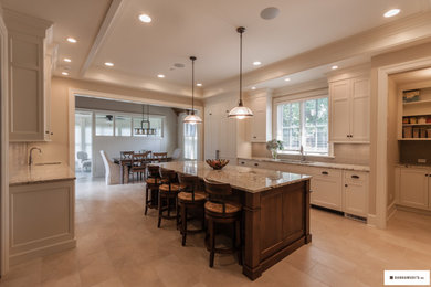 Transitional kitchen photo in Chicago with shaker cabinets, white cabinets and an island
